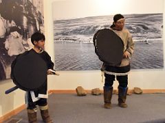 04A A Young Boy And Lamech Kadloo Demonstrate Traditional Inuit Drum Dancing In Pond Inlet Mittimatalik Baffin Island Nunavut Canada For Floe Edge Adventure